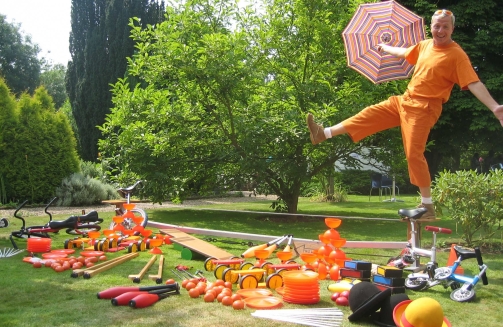 Man balancing performing circus skills tricks'